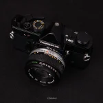 دوربین Olympus OM-1 با لنز 50mm f/1.8